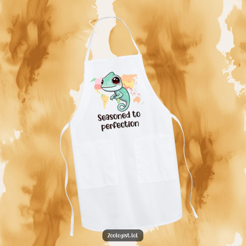 Funny chameleon apron featuring a happy chameleon blending into a colorful world map, perfect for kitchen explorers.