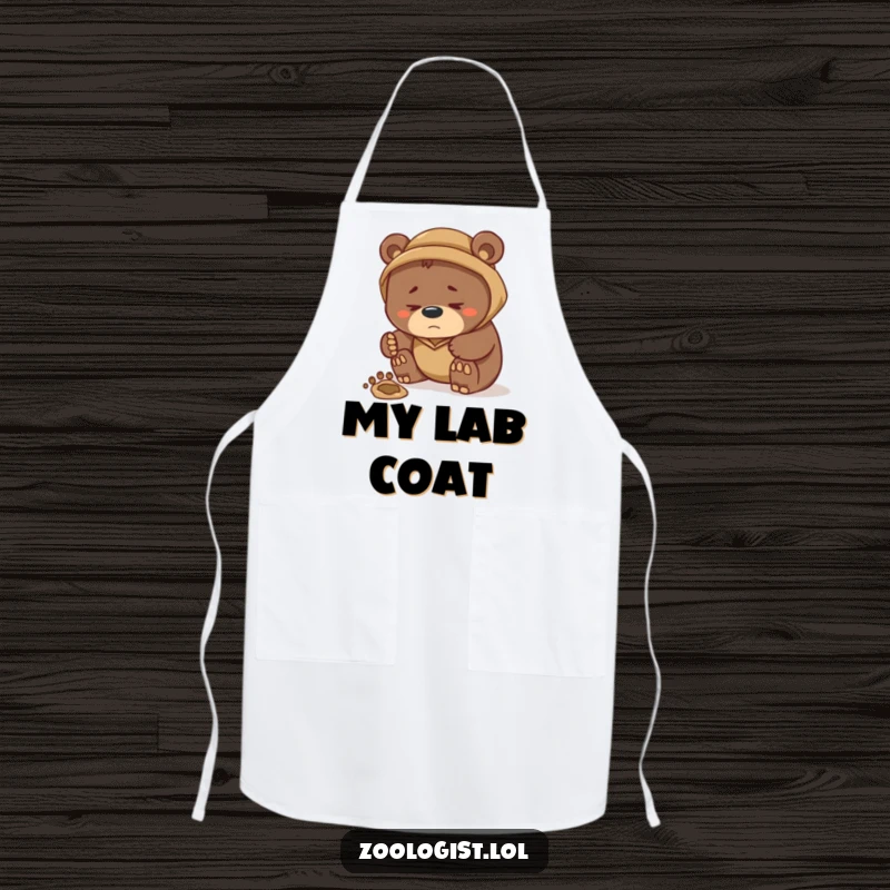 Funny apron featuring a studious bear zoologist examining a mysterious ingredient footprint, adding a humorous twist to kitchen preparedness and culinary exploration.