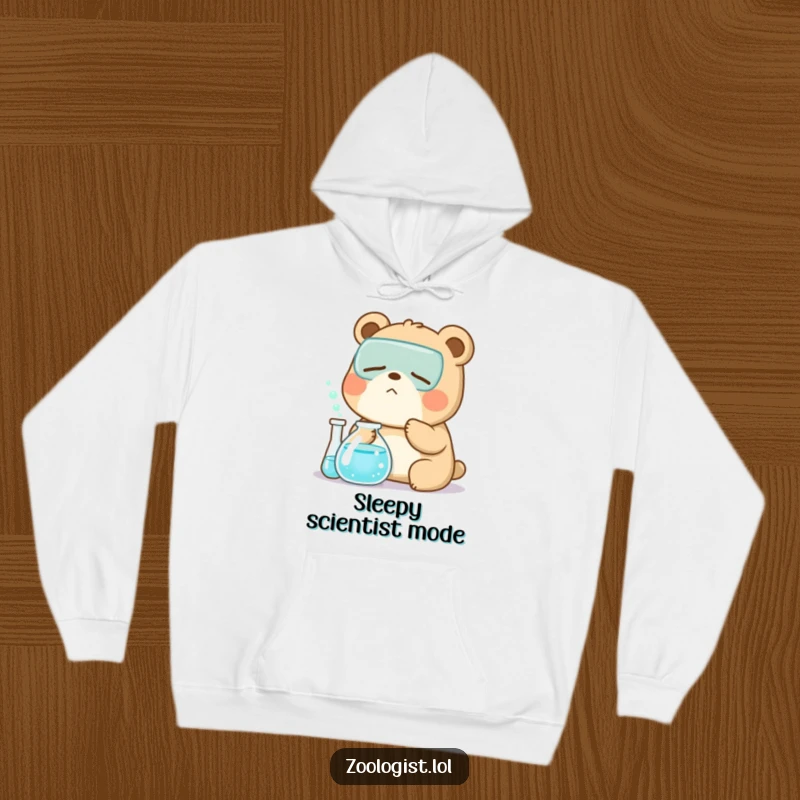 Funny Kawaii bear zoologist character yawning near a bubbling beaker, a warm and humorous hoodie for sleepy scientists.
