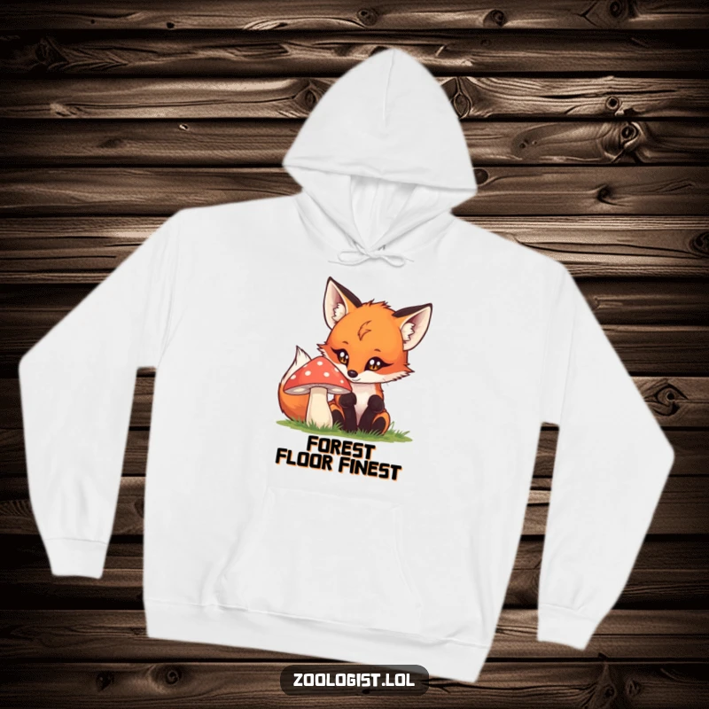 Funny fox hoodie showing a curious creature gazing at a mushroom, offering comfort and humor for nature fans.