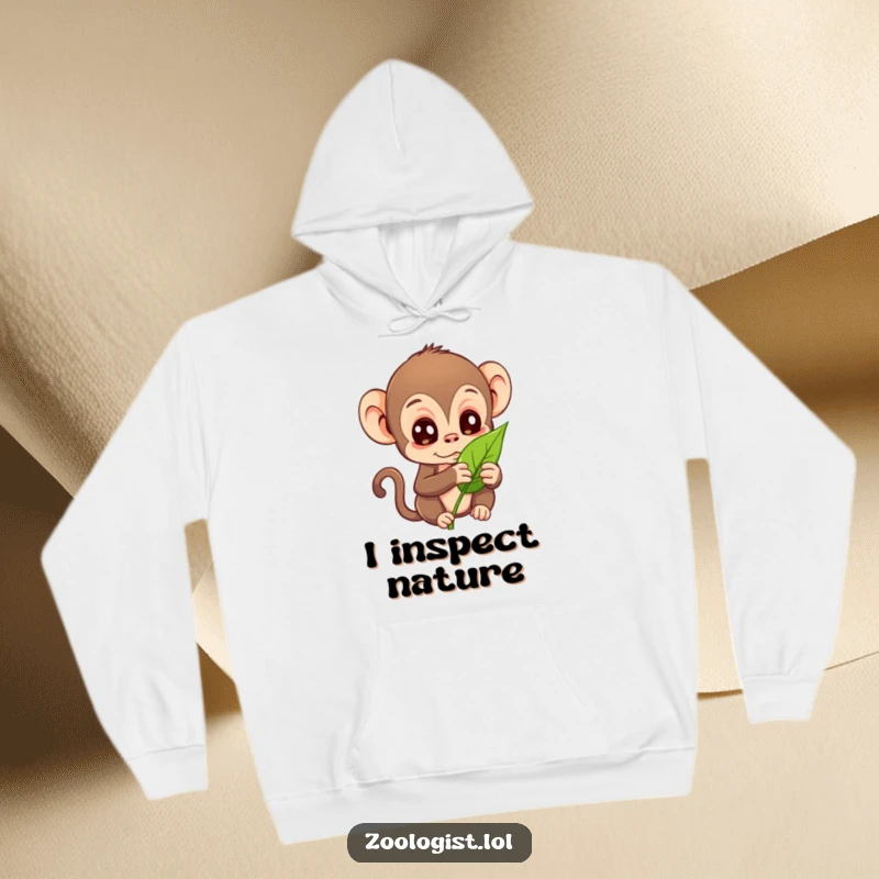 Funny hoodie with a curious monkey examining a leaf, ideal as a warm funny gift for nature fans.