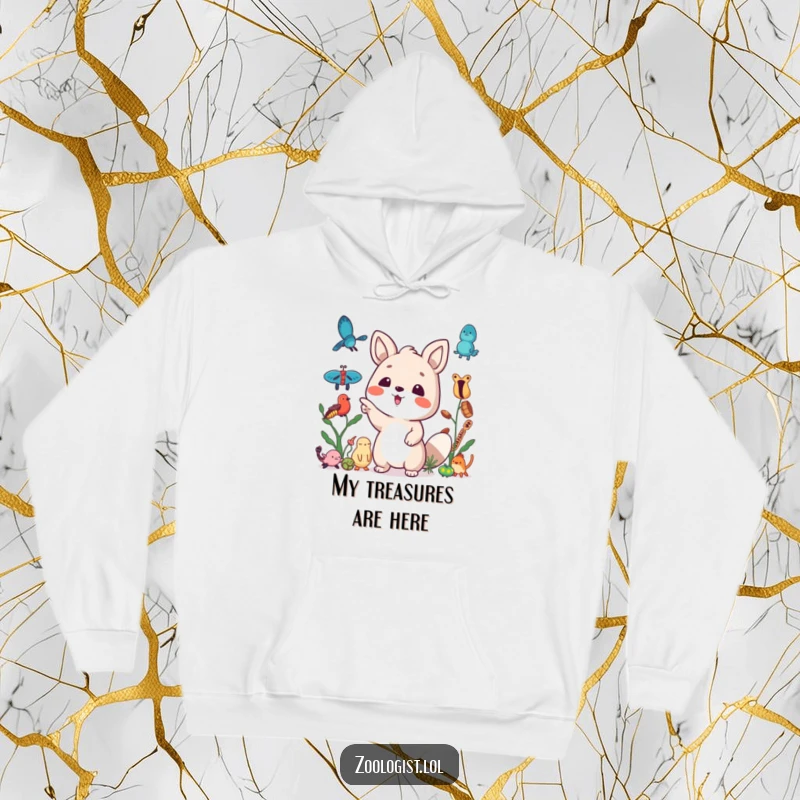 Funny hoodie with a cute animal character excitedly pointing towards a collection of assorted specimens, highlighting a collector's joy.