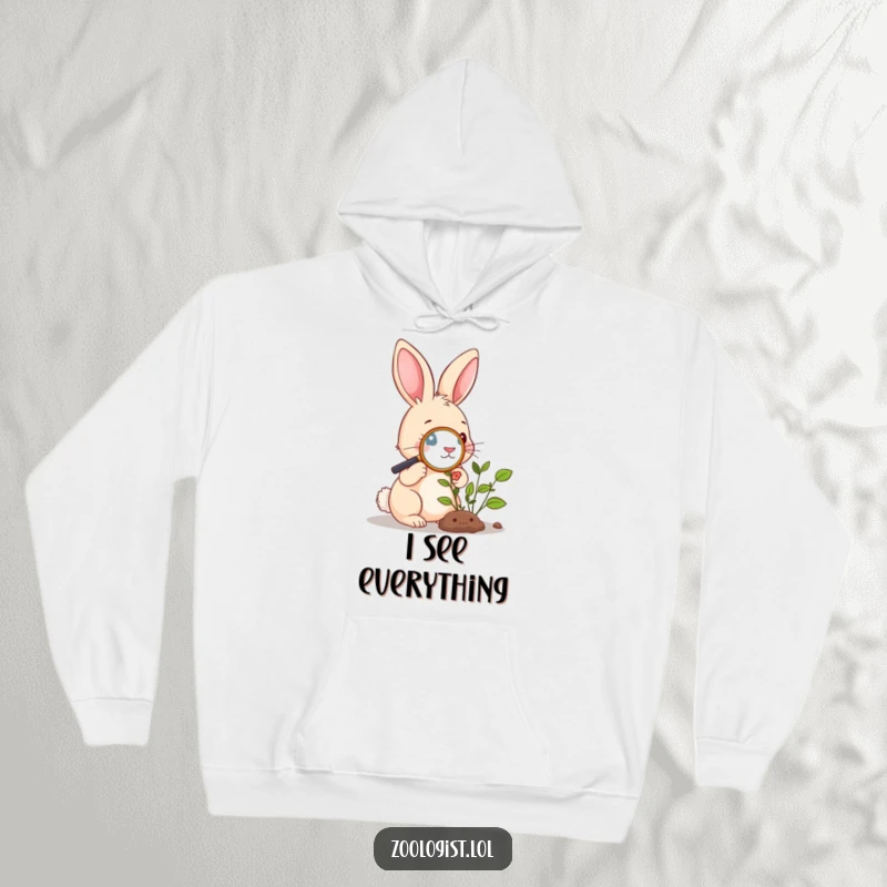 Funny Hoodie: Cute rabbit examining a plant with a magnifying glass, representing a keen interest in the natural world.