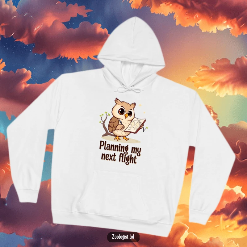 Funny owl hoodie, an artistic owl diligently sketching a savanna map, looking content, perfect for creative minds and nature lovers.