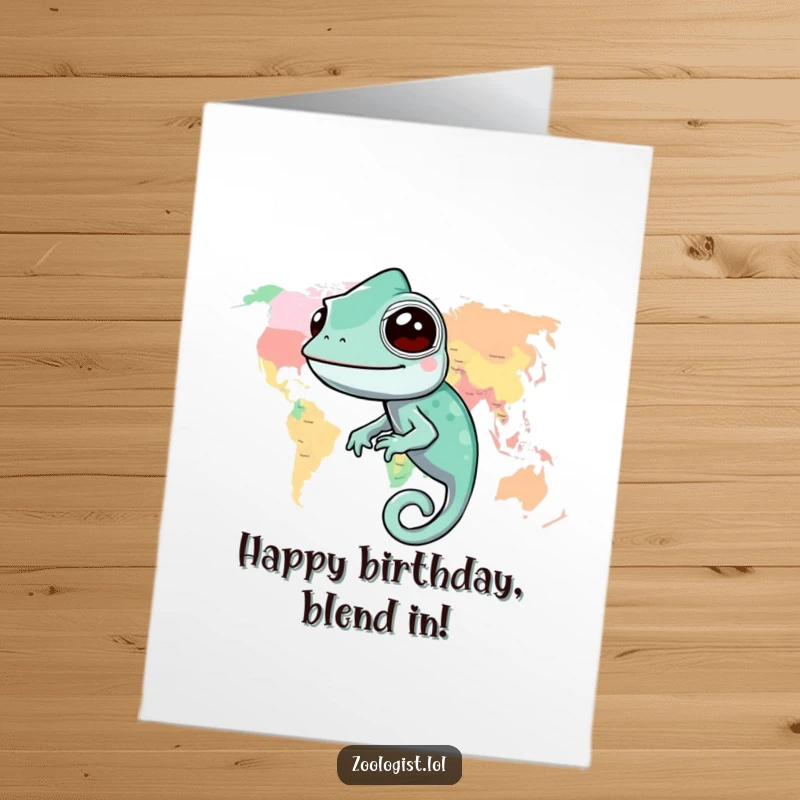 Funny Free Printable Birthday Card: A smiling chameleon perfectly blended into a vibrant, colorful world map illustration.